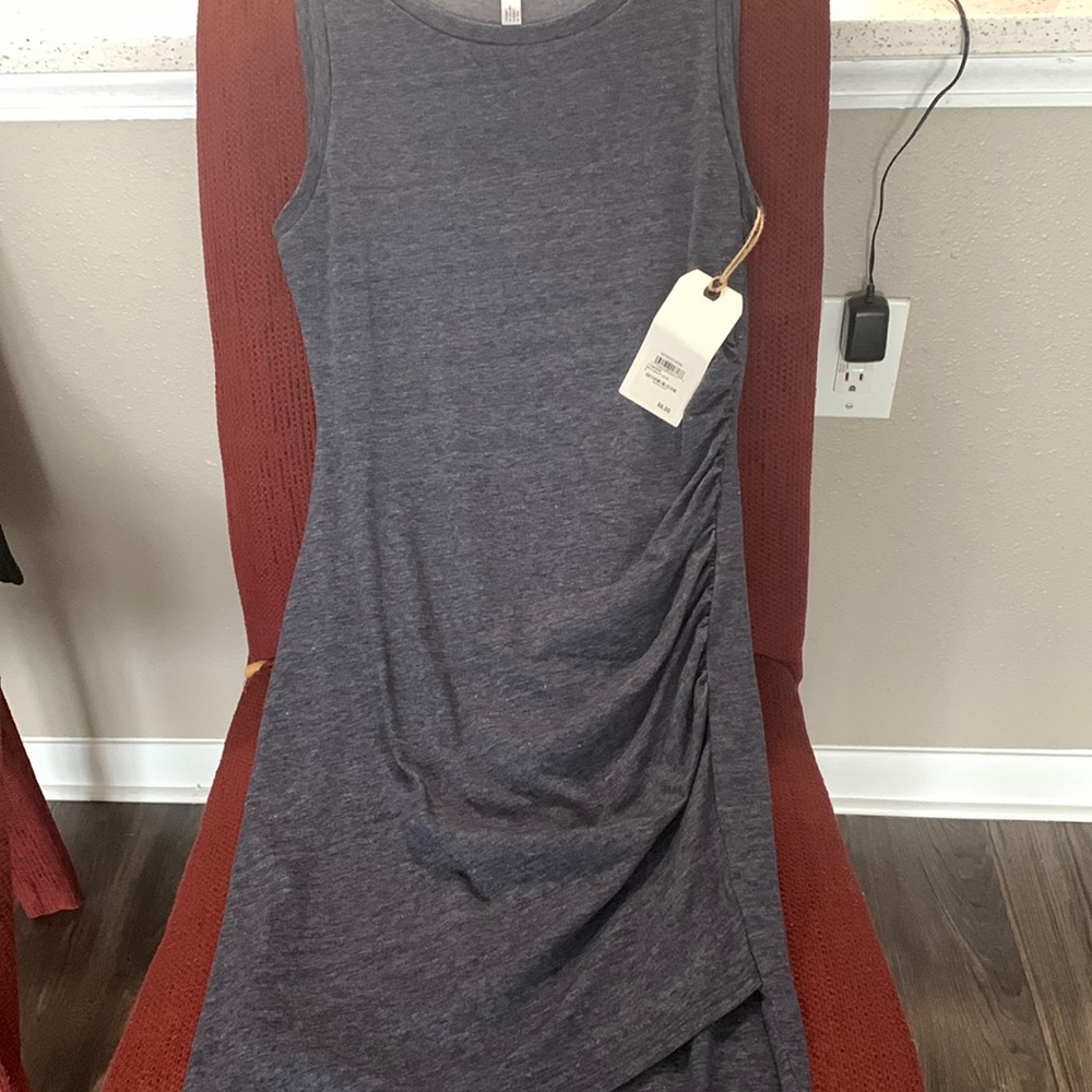 Brand new T-shirt dress with ruched on side. Fits snugly